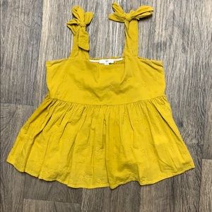 Mustard yellow crop top.